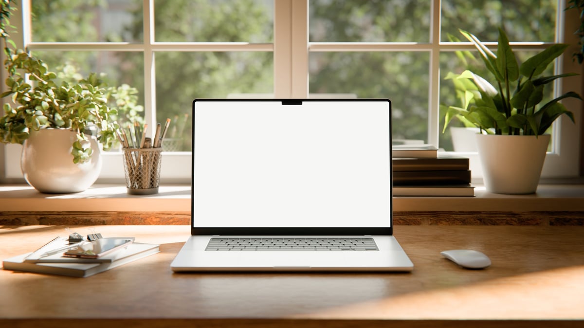 laptop screen mockup images captured in a bright industrial loft interior